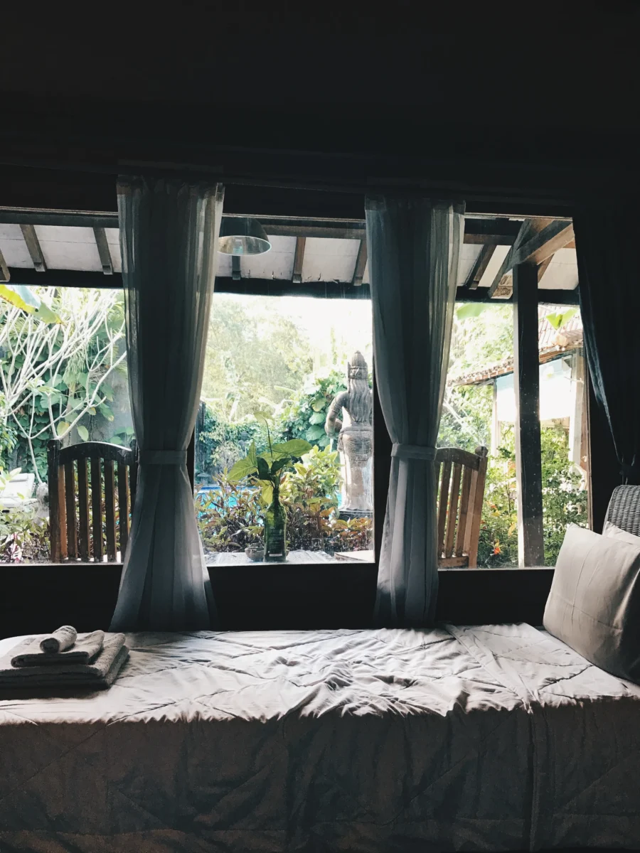 bed in front of window